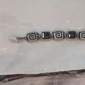 Sterling bracelet with Garnet pyramids. Needs clasp repair
